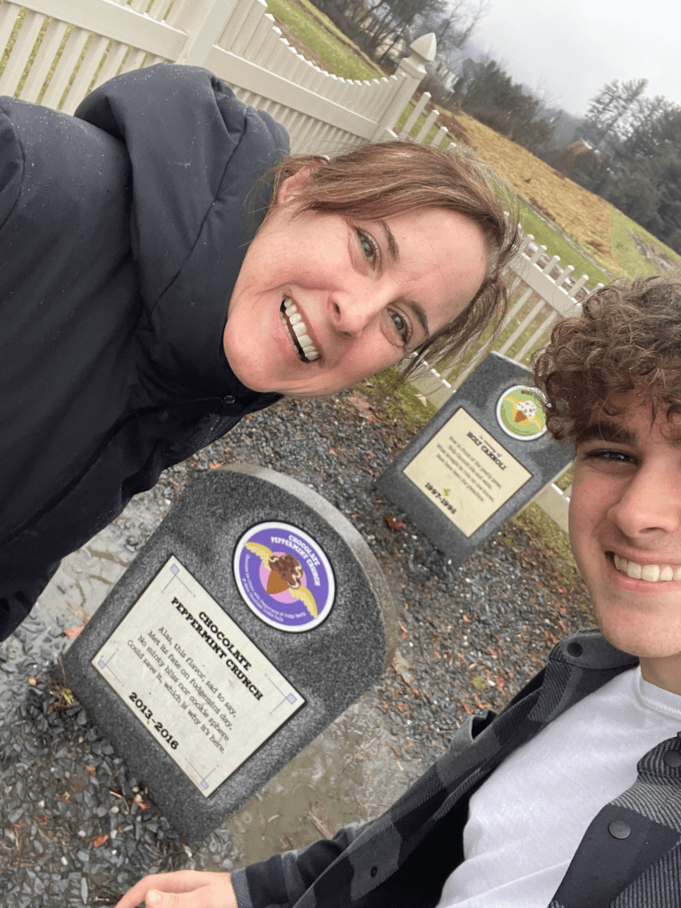 Paige and son at Ben & Jerry's cemetery of retired flavors.